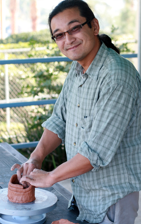 Professor Yoshimi Hayashi working on a ceramic vessel